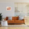 Living room interior wall mockup in warm tones with leather sofa which is behind the kitchen.
