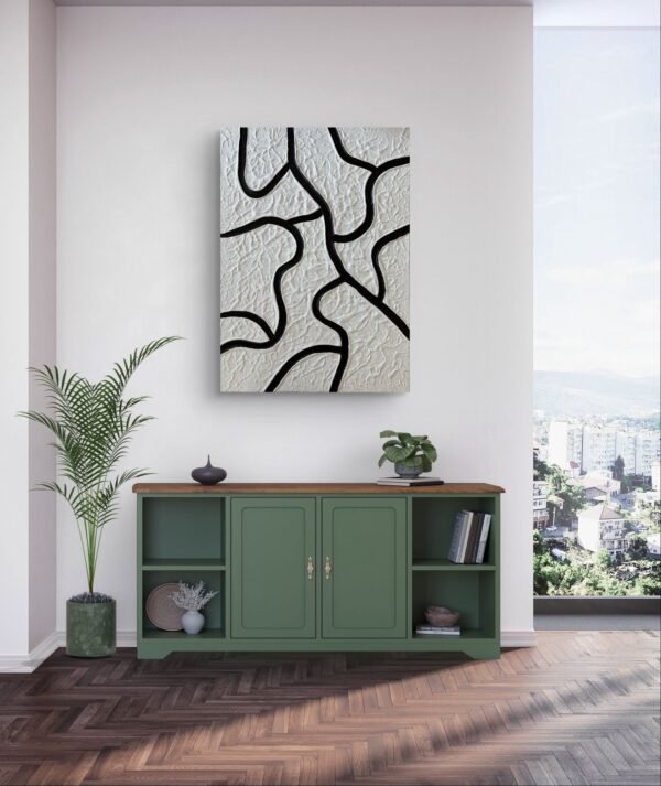 Vue du ciel Un tableau abstrait texturé en blanc et noir, inspiré d’une vision aérienne. Les lignes courbées creusées dessinent un paysage organique et minimaliste. Une œuvre élégante qui joue avec la lumière et la matière.